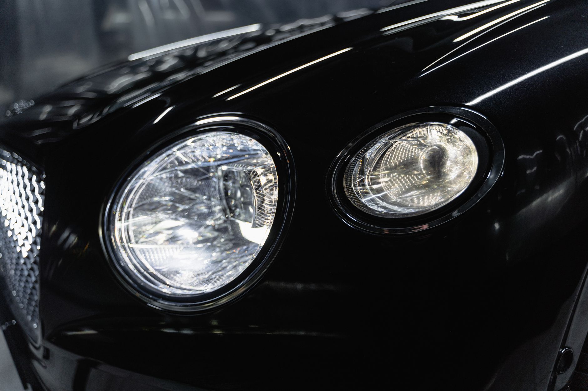 Close-up of a premium detailed car headlight, glossy finish